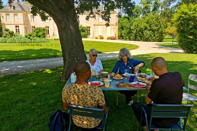 Bordeaux Full Day Wine Tour - 3 Wineries & Gourmet Picnic Lunch - Walking through Saint-Émilion village with your guide