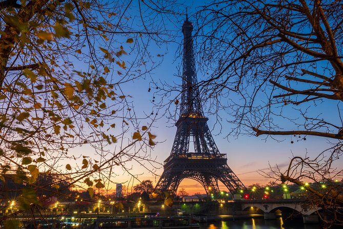 Eiffel Tower Guided Tour by Stairs with Optional Summit by Lift - First-floor stop: glass floor, spiral staircase, and a breather before the views
