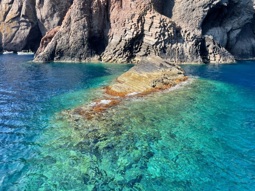 From Cargèse: Scandola Day Tour & Girolata Lunch Stop - Capo Rosso: the caves and red rock coves that feel unfair