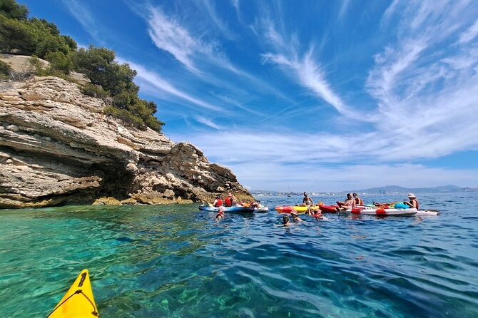Guided kayak excursion in creeks - The swim break in a cove: best payoff, rocky reality