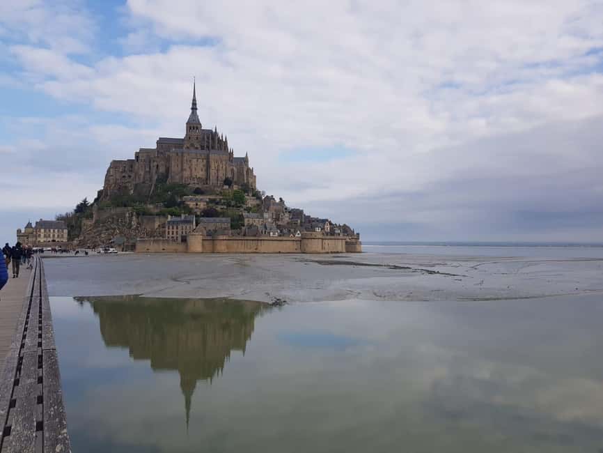 Mont Saint Michel: Village History and Legends Walking Tour - Bridge walk versus shuttle: plan for both, enjoy whichever happens