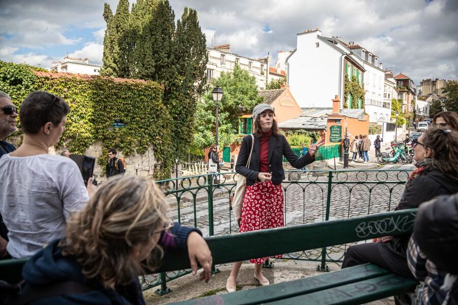 Montmartre en chansons: tour with a professional singer - Moulin de la Galette: where the hill feels like a stage
