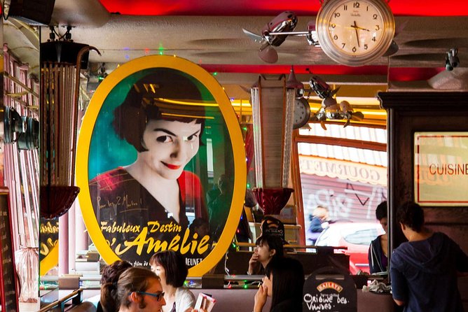 Montmartre Hill French Gourmet Food and Wine Tasting Walking Tour - Starting at Place Blanche and getting your bearings near Moulin Rouge