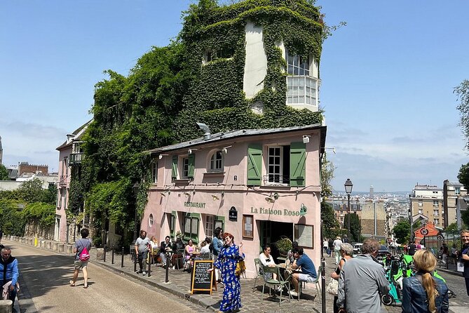 Montmartre Hill French Gourmet Food and Wine Tasting Walking Tour - Landmark moments on the walk: windmills, old streets, and a very Montmartre climb