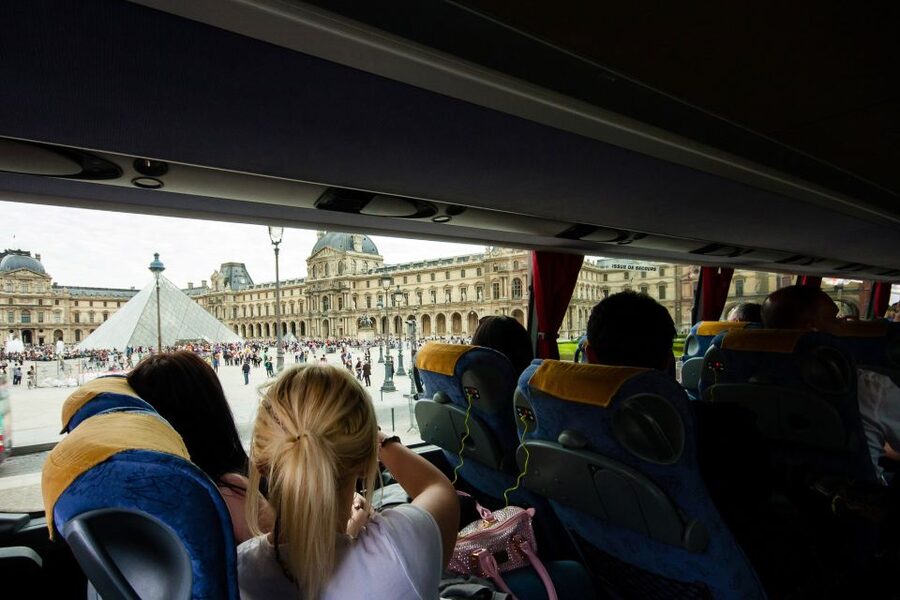Paris: Audio-Guided Bus Tour & Seine River Cruise - Interactive tablet storytelling: 3D reconstructions and before/after views