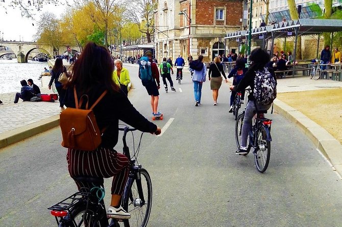 Paris: Charming Nooks and Crannies Bike Tour - Crossing the Seine into Le Marais, then tracing Kings Square to the Bastille story