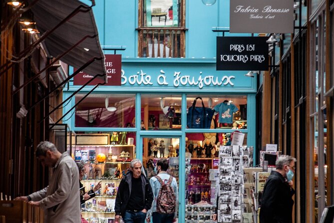 Paris Covered Passages Walking Tour plus Seine Cruise Option - Passage Choiseul: sunlit shops under glass