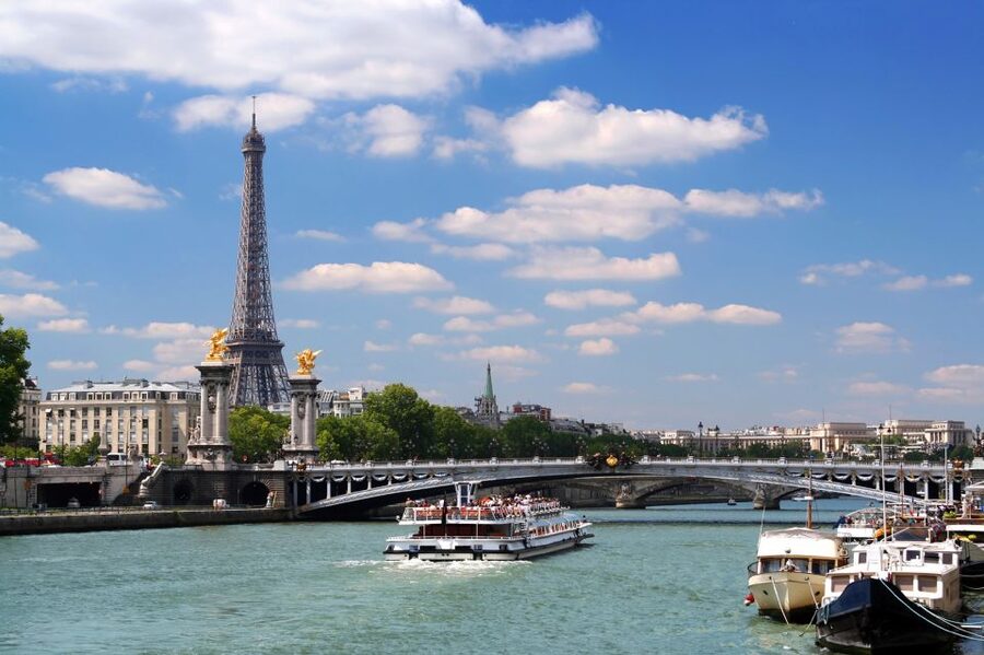 Paris: Eiffel Tower Tour & Seine River Cruise Tour - Entering the Eiffel Tower: security and elevator reality checks