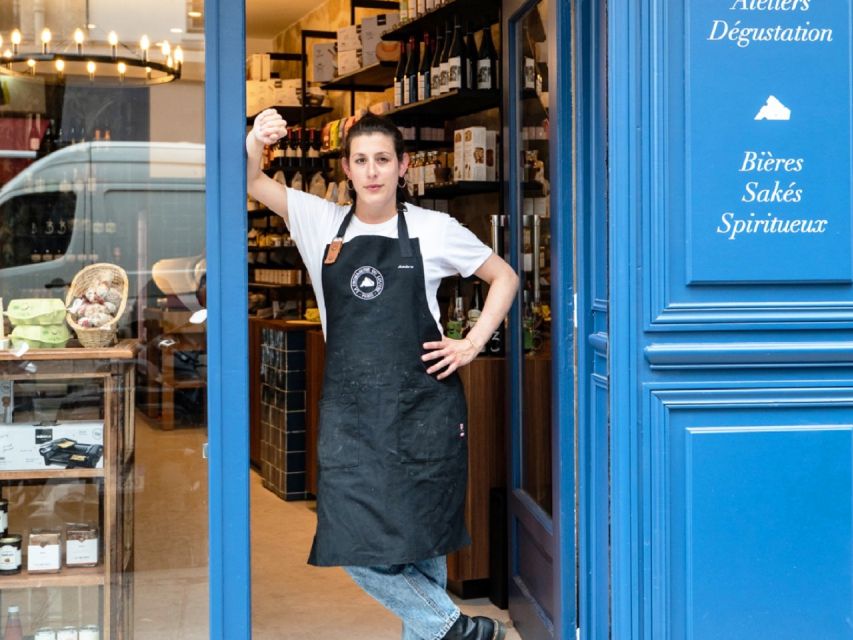 Paris: Gourmet Food Tour with Over 10 Tastings and Wine - Wine bar pairing: two glasses, charcuterie, and a calm sit-down