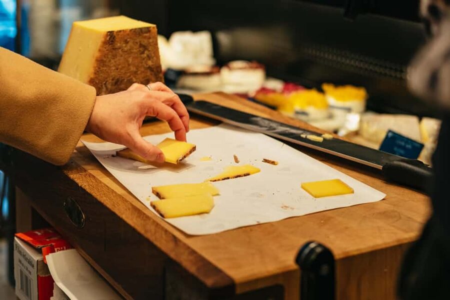 Paris: Gourmet Food Tour with Over 10 Tastings and Wine - Rue des Petits Carreaux market plus brioche to end on a high note