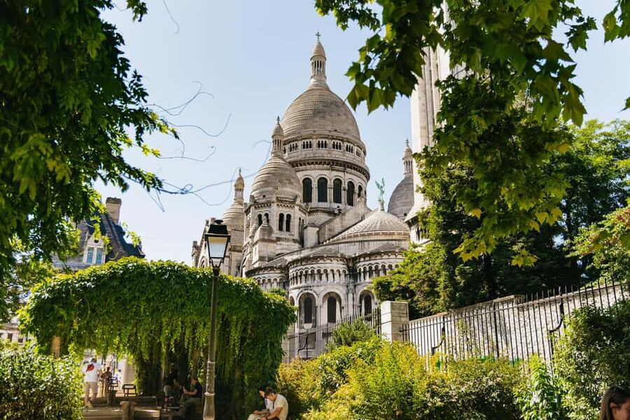 Paris: Hidden Gems of Montmartre with Local Guide - Moulin Rouge Windmill to Moulin de la Galette: The Looking-Glass Side of Paris
