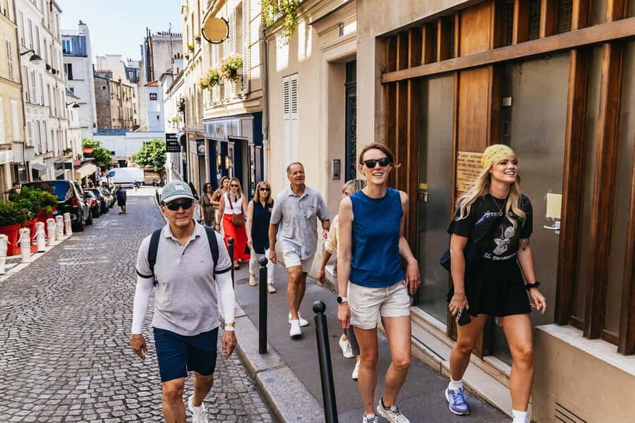 Paris: Montmartre Cheese, Wine & Pastry Guided Walking Tour - Place du Tertre and Le Moulin Rouge: Icons with Context