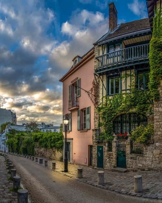 Paris: Montmartre Highlights Walking Tour with a Local Guide - Place Saint-Pierre Under Sacré-Cœur, Then Paris Opens Up