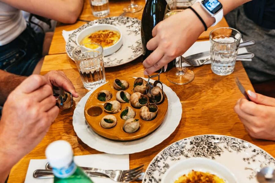 Paris: Walking Food Tour with Cheese, Wine and Delicacies - The restaurant stop, a sit-down tasting moment