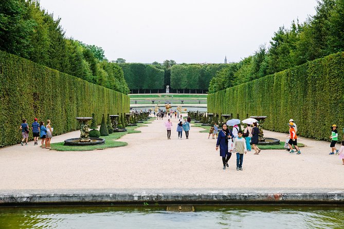 Versailles Château and Gardens Walking Tour from Paris by Train - Tapis Vert and the Grand Canal: planned photo moments that pay off